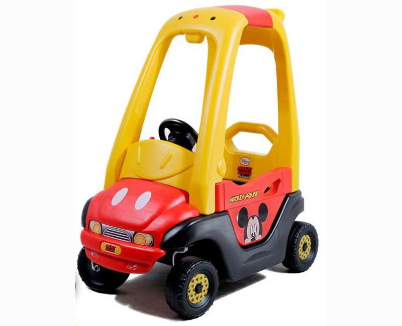 red and yellow plastic pedal car